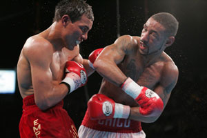 Corrales delivers a straight right hand to Castillo's chin (pic Tom Casino)