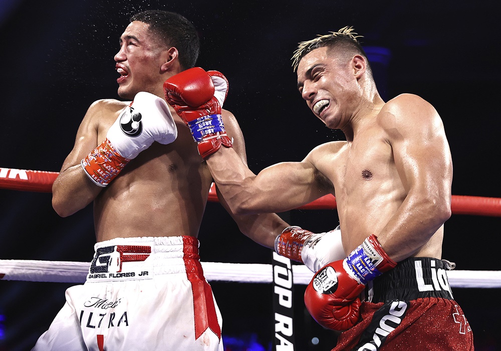 Lopez whips Flores Jr. photo by Mikey Williams Top Rank via Getty Images 