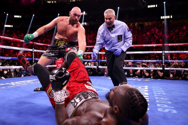 Floored twice, Tyson Fury rises to stop Deontay Wilder